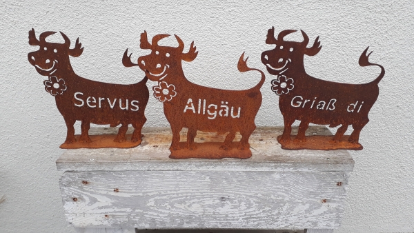 Deko Spaß Kuh mit der Schrift Griaß di ein Blickfang für ihren Eingang 25x25 cm